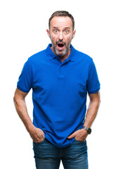 Fototapeta premium Middle age hoary senior man over isolated background afraid and shocked with surprise expression, fear and excited face.