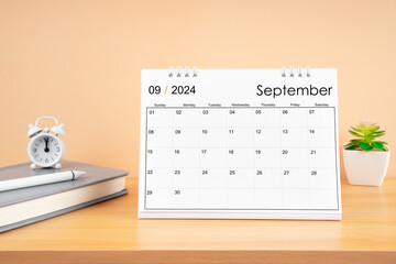 September 2024, Monthly desk calendar for 2024 year on wooden table.