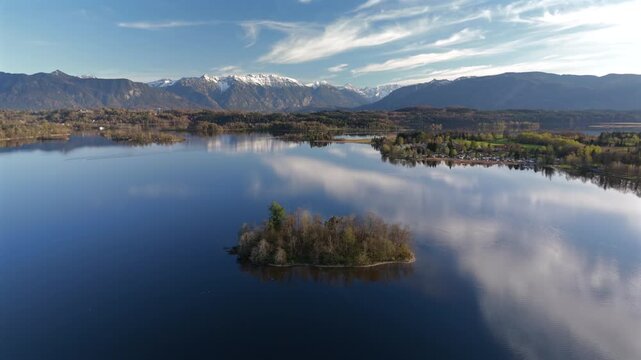 Aerial view, Staffelsee with islands, Garmisch Partenkirchen region, Bavaria, Germany near Murnau in sunny weather at sunset in spring. Drone view over islands of a large beautiful lake in Bayern. 