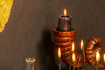 Witchcraft composition selective focus with candles lights, magic items tools and symbols.  Occult...