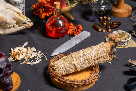 Selective focus at crystal athame, a ceremonial blade, ritual implement and magical tool used in ceremonial magic traditions. Neopagans, witchcraft, and satanic traditions.