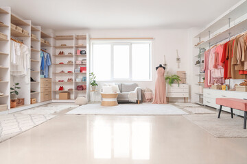 Interior of dressing room with stylish clothes and accessories