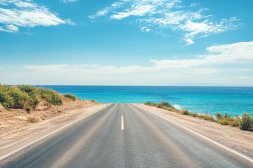 Empty asphalt road leading to ocean landscape  summer beach travel scenery with blue sky horizon