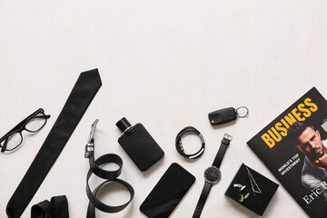 Set of male accessories with belt, eyeglasses and mobile phone on white background. Top view