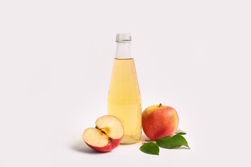 Bottle of fresh apple cider and fruits on white background