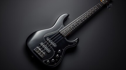 Obraz premium A sleek electric bass guitar with its frets and pickups visible, set against a dark background to highlight its modern design.