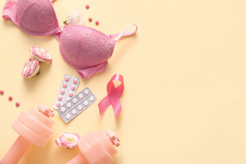 Composition with pink ribbon, female bra, pills and dumbbells on color background. Breast cancer awareness concept