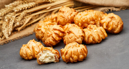 Delicious cream-filled profiteroles, golden and crisp, perfect for a sweet dessert treat