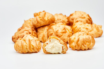 Delicious cream-filled profiteroles, golden and crisp, perfect for a sweet dessert treat
