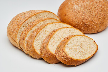 Whole wheat bread loaf sliced, showcasing its hearty texture and rich, wholesome flavor