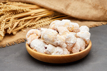 Powdered sugar-coated pastries filled with jam, perfect for sweet cravings and dessert lovers