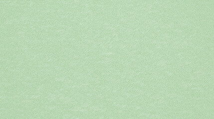 a seamless texture of slightly textured colored paper in faded honeydew color