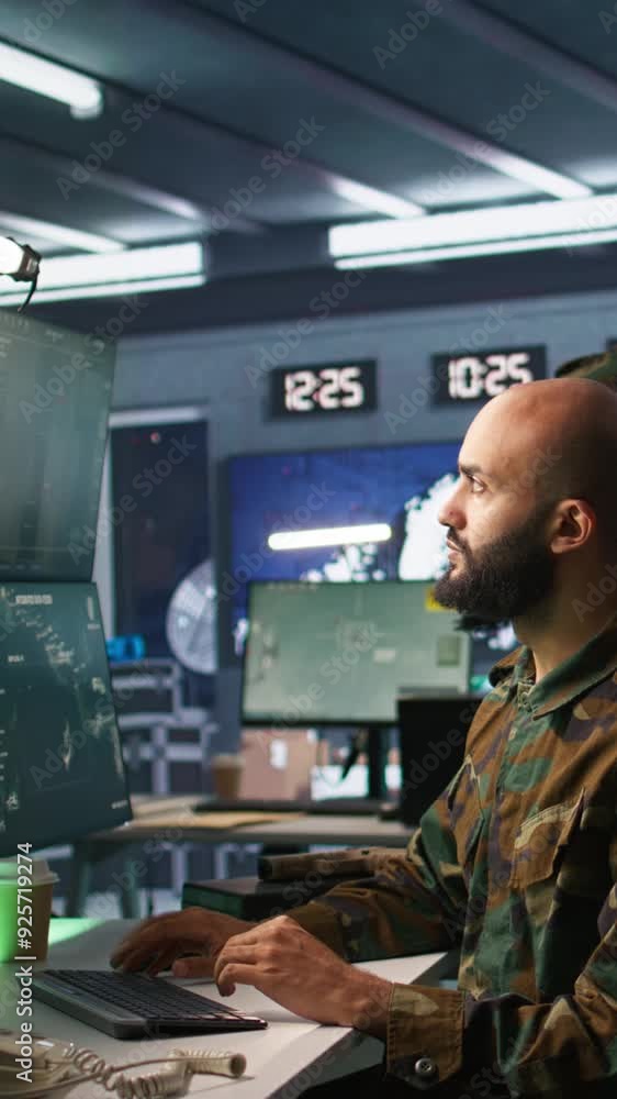 Poster vertical video military agent working in control room, analyzing aerial reconnaissance data. intelli