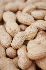 top view of Several peanuts in a basket.