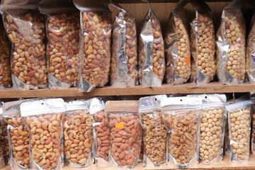 many mixed nuts in a plastic packet on shelf 