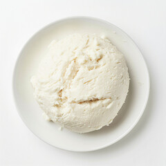 a white plate topped with a scoop of ice cream