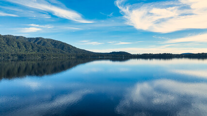 Aerial footage of the alpine lake surrounded by the Southern Alps mountain range