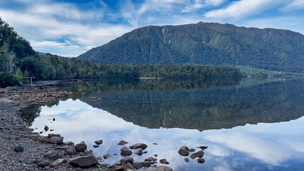 Aerial footage of the alpine lake surrounded by the Southern Alps mountain range