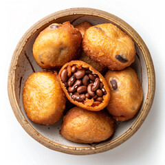 a bowl of food with beans and a piece of bread