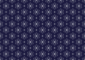 White symbol floral on dark blue background, ethnic fabric seamless pattern design for cloth, carpet, batik, wallpaper, wrapping etc.