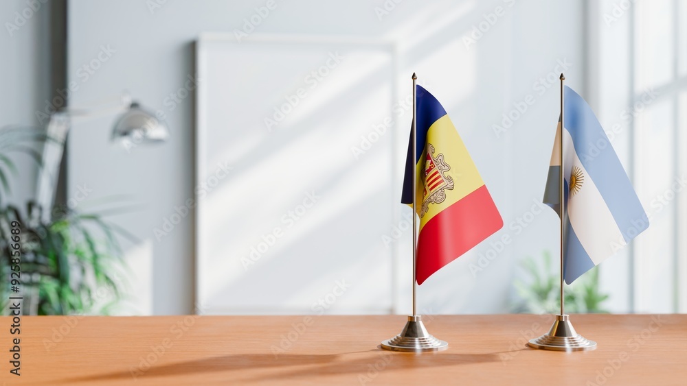 Wall mural flags of andorra and argentina on table