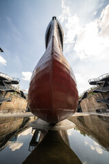 A submarine being repaired in a shipyard.