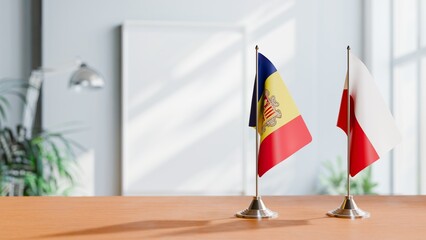 FLAGS OF ANDORRA AND POLAND  ON TABLE