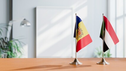 FLAGS OF ANDORRA AND SUDAN  ON TABLE