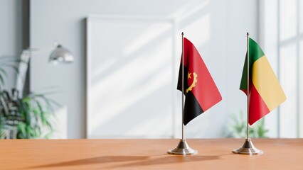 FLAGS OF ANGOLA AND BENIN  ON TABLE