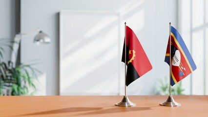 FLAGS OF ANGOLA AND ESWATINI  ON TABLE
