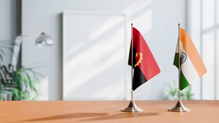 FLAGS OF ANGOLA AND INDIA  ON TABLE