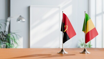 FLAGS OF ANGOLA AND MALI  ON TABLE