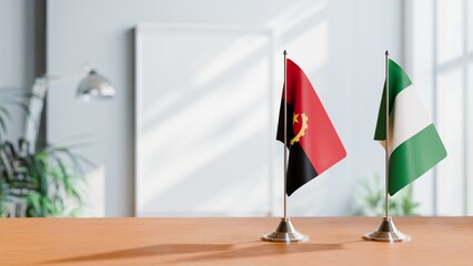 FLAGS OF ANGOLA AND NIGERIA  ON TABLE