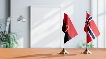 FLAGS OF ANGOLA AND NORWAY  ON TABLE