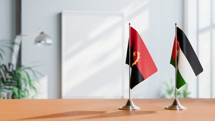 FLAGS OF ANGOLA AND PALESTINE  ON TABLE