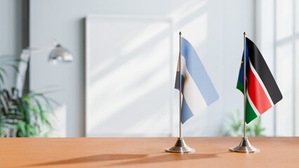 FLAGS OF ARGENTINA AND SOUTH SUDAN ON TABLE