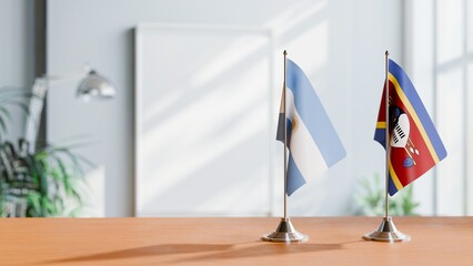 FLAGS OF ARGENTINA AND SWAZILAND  ON TABLE