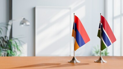 FLAGS OF ARMENIA AND GAMBIA  ON TABLE