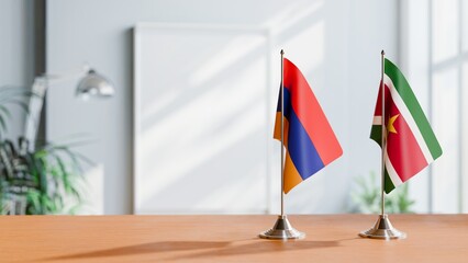 FLAGS OF ARMENIA AND SURINAME  ON TABLE