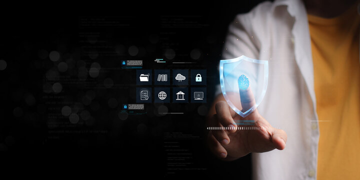 Man using thumb to scan finger print or for digital processing biometric identification to access security system includes internet banking, cloud system and mobile phone , Cyber security concept.