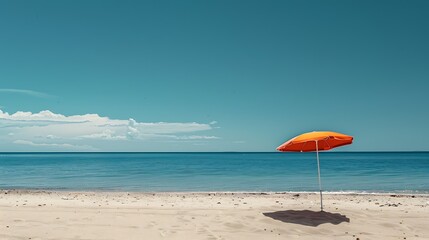 Isolated beach umbrella on a sandy shore. Simple and peaceful.