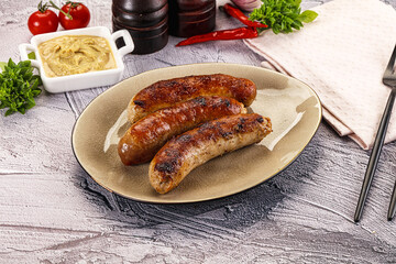 Delicous natural roasted sausages in the plate