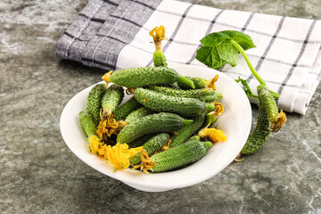 Raw gherkin cucumbers in the bowl
