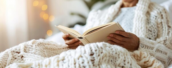 Quarantined person reading a book while resting in bed, isolation, self-care during illness