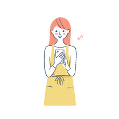 スマートフォンを操作しているエプロン姿の女性