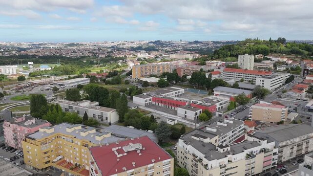 Aerial - Gondomar city center, Portugal, featuring residential buildings, roads, and surrounding urban landscape
