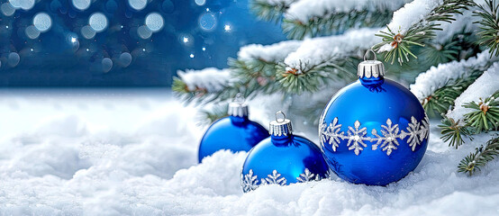 Beautiful background with Christmas and New Year decorations and blue glowing balls on a fir branch. Template winter Christmas picture with space for text. Christmas New Year fairytale mood.
