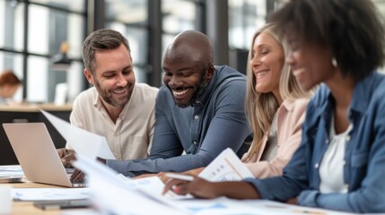 Fototapeta premium A group of four professionals engage in a lively discussion, reviewing documents and sharing smiles in a contemporary office setting