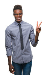 Young african american business man over isolated background smiling with happy face winking at the camera doing victory sign. Number two.