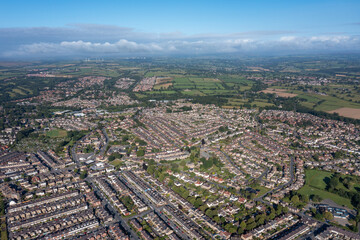 Aerial drone photo of the British town of Harrogate in North Yorkshire England which is east of the Yorkshire Dales in the summer time showing streets of residential housing estates from above